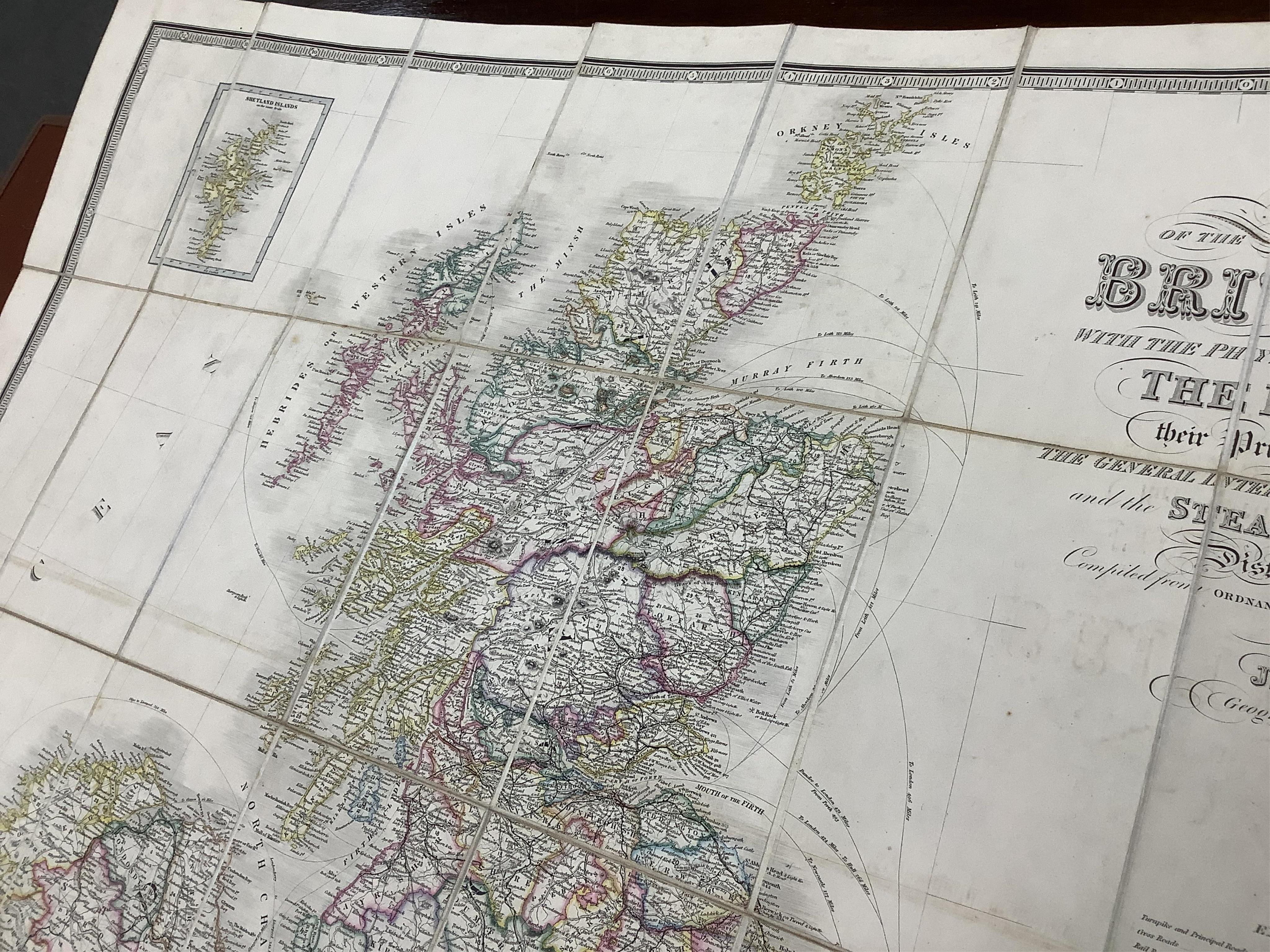 James Wyld, a mid-19th century cloth mounted map of the British Isles, including the line of railways, their primary and intermediate stations, etc. engraved by S. Stockley, in a slip case. Condition - poor to fair.